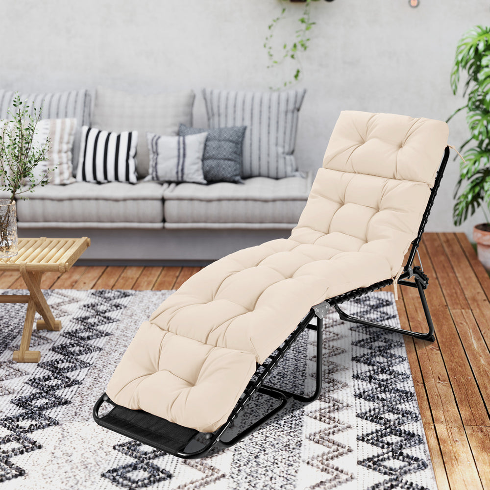 High back outdoor lounge chaise cushion in beige, 73"x22", featuring string ties for secure placement in any setting.