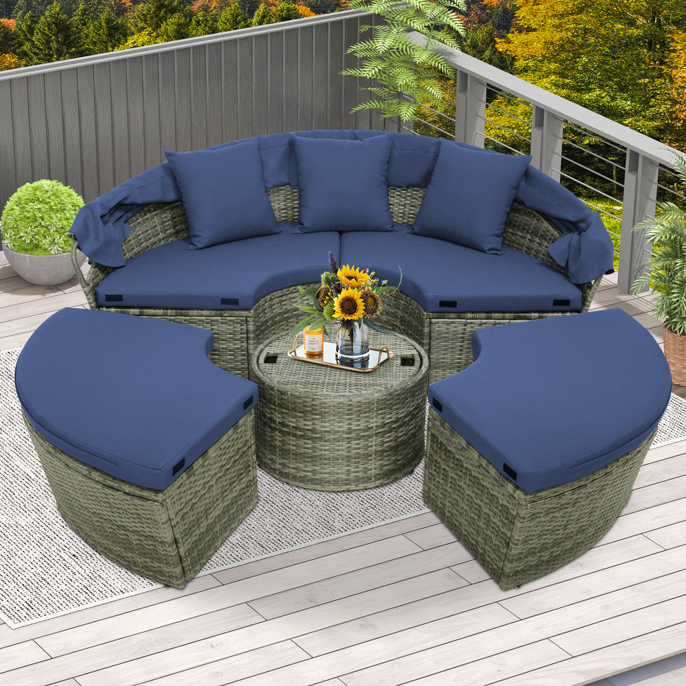 Round outdoor daybed set with navy cushions, featuring a retractable canopy and PE wicker, perfect for patio relaxation.