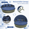 Outdoor PE wicker round daybed with retractable canopy and navy cushions, ideal for sunbathing or reading in the.