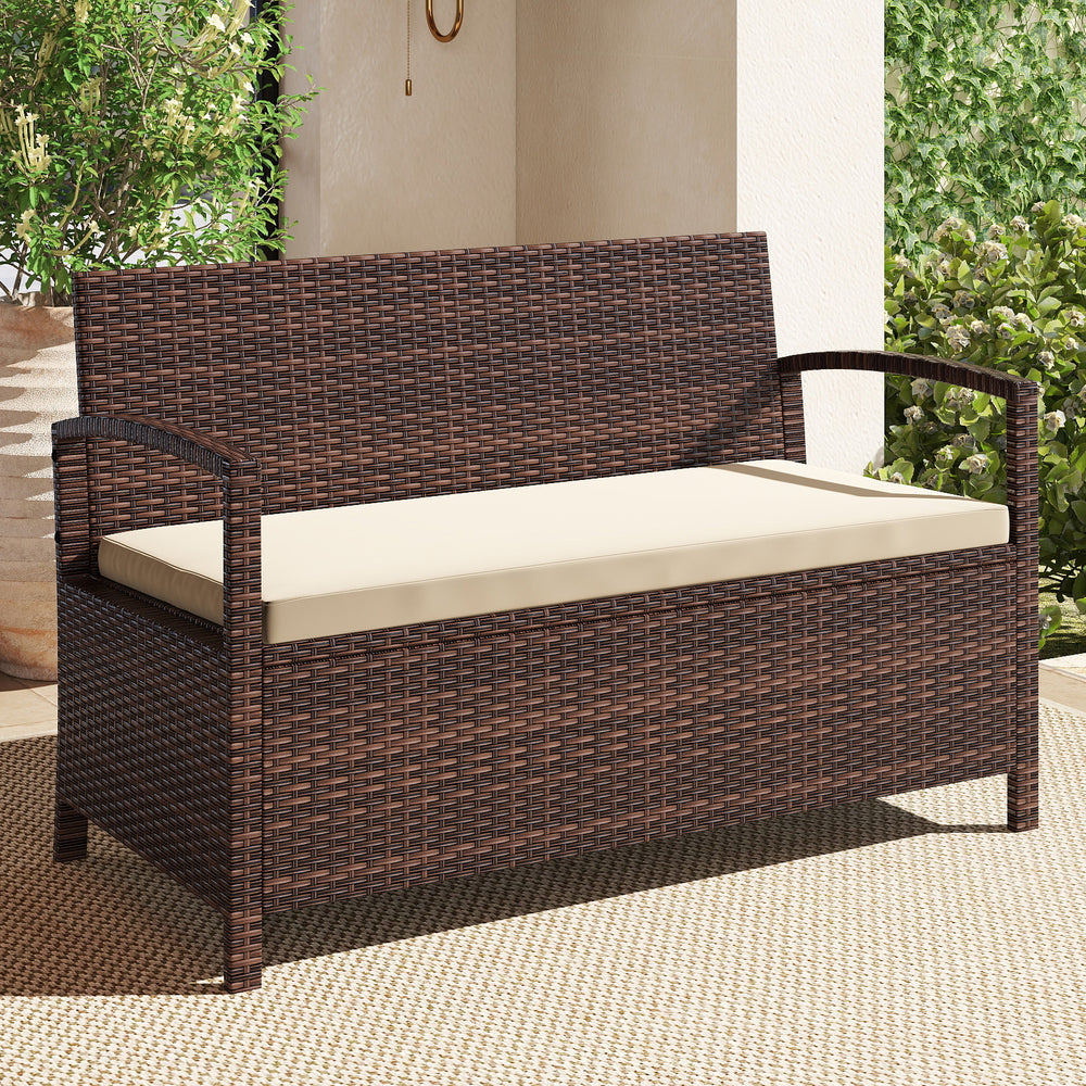 Outdoor PE wicker storage bench with beige cushion, featuring 42-gallon storage, ideal for patio and garden relaxation.