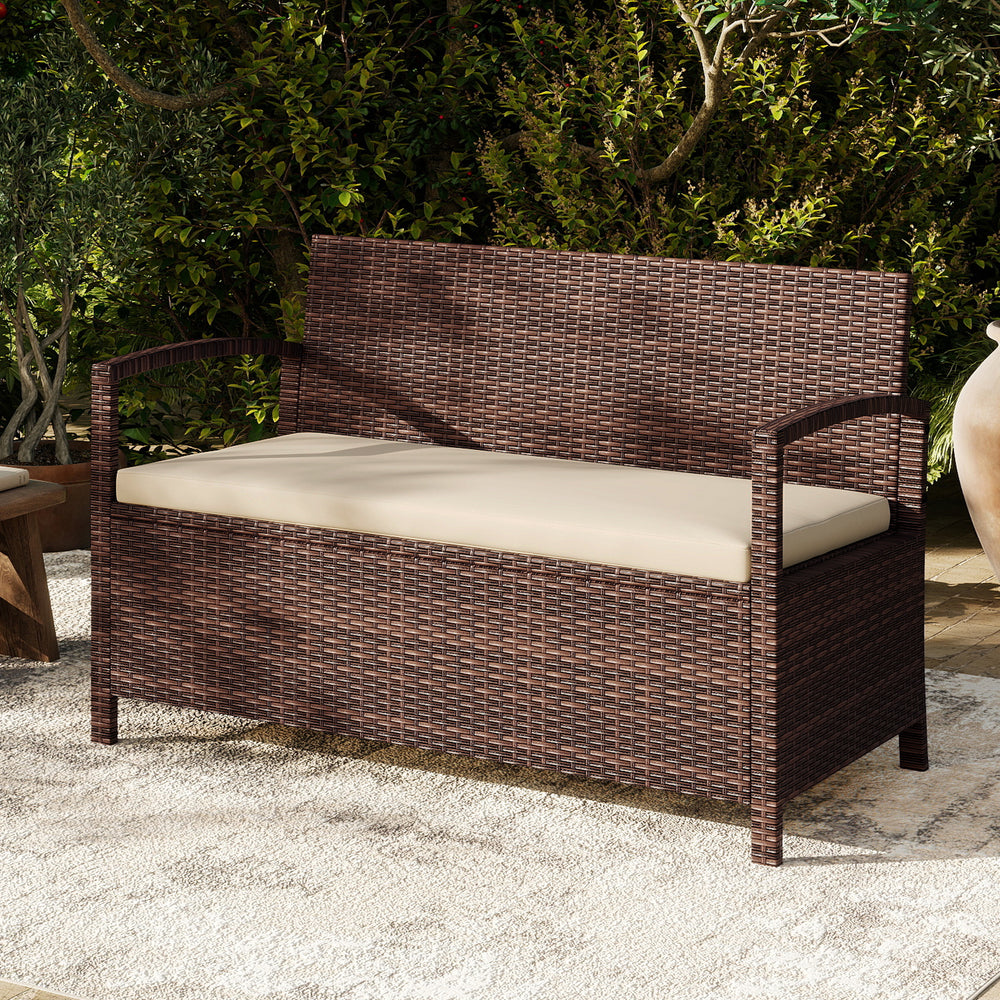 Outdoor PE wicker storage bench with beige cushion, featuring 42-gallon storage and ergonomic design for patio.