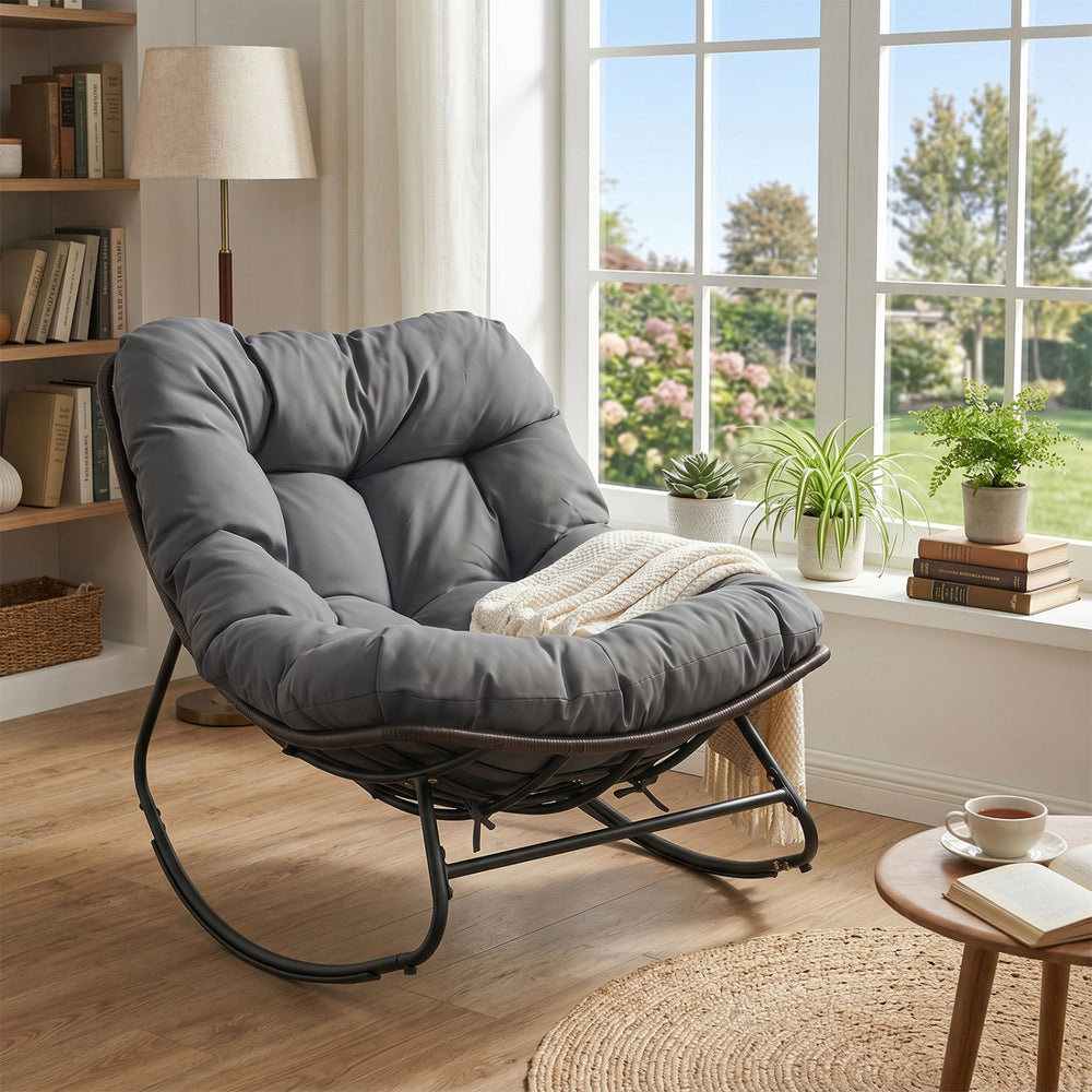 Gray Outdoor Papasan rocking chair with thick cushion, ergonomic design, and stable non-slip pads for comfortable.