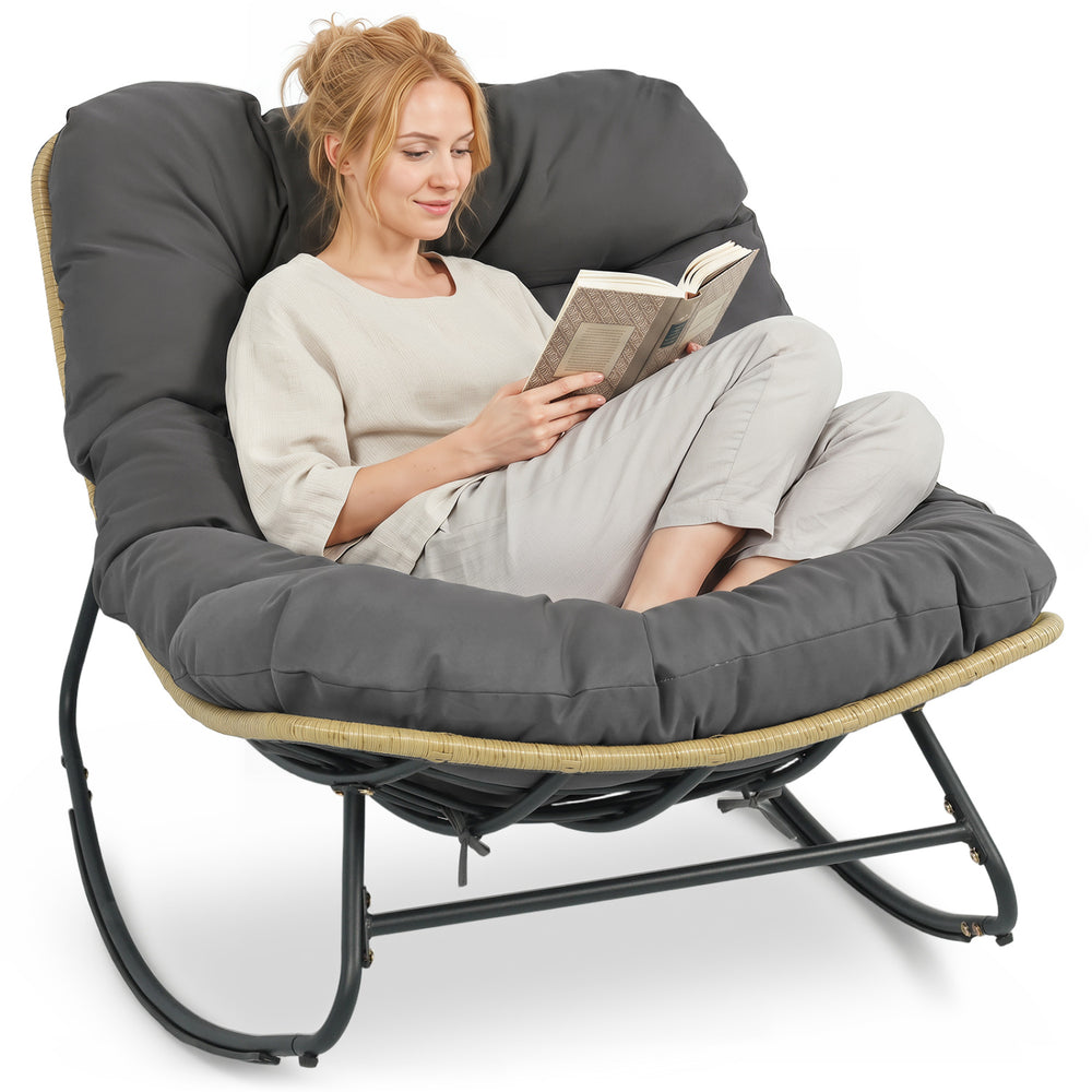 Outdoor Papasan rocking chair with thick gray cushion, ergonomic design for comfort and support, perfect for patio.