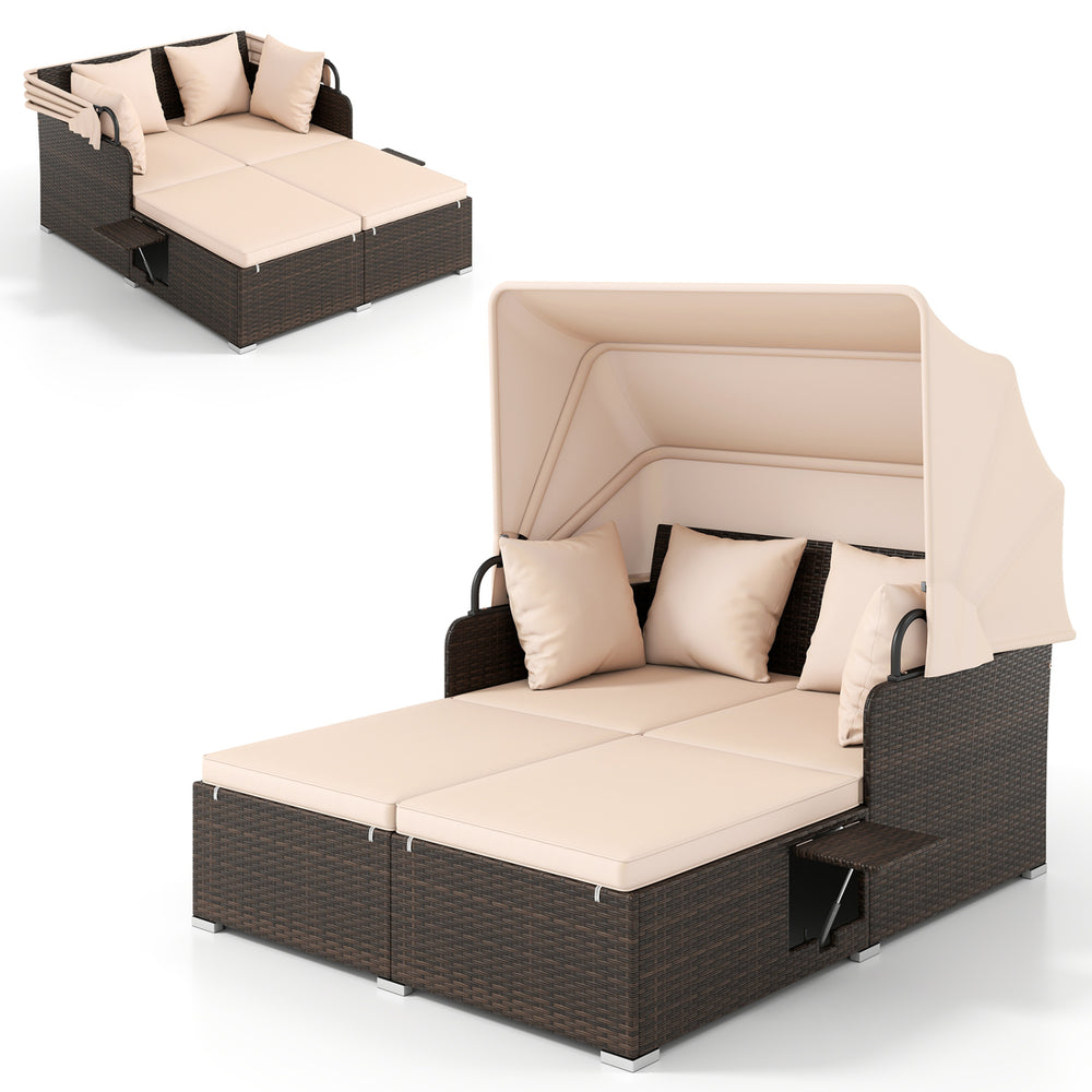 Outdoor patio rattan daybed with retractable canopy, beige cushions, and side tables, perfect for backyard relaxation.