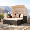 Outdoor patio rattan daybed with retractable canopy and beige cushions, perfect for backyard relaxation.