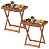 Foldable outdoor patio tray table made of solid wood with slatted top, featuring cut-out handles for easy transport.