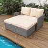 Peach-colored cushion on the outdoor rattan loveseat, designed for comfort with zippered covers for easy cleaning.