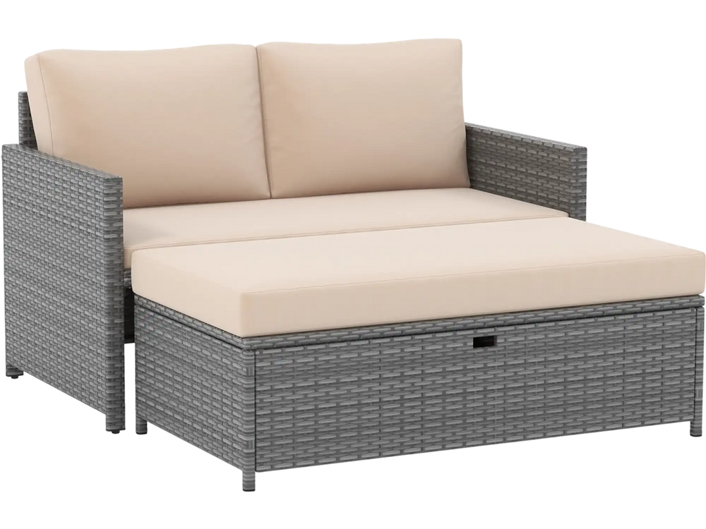 Gray PE rattan outdoor loveseat with cushions and 31-gallon storage ottoman, perfect for backyard relaxation.