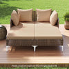 Outdoor rattan double daybed with brown cushions, featuring a sturdy metal frame, ideal for poolside relaxation.