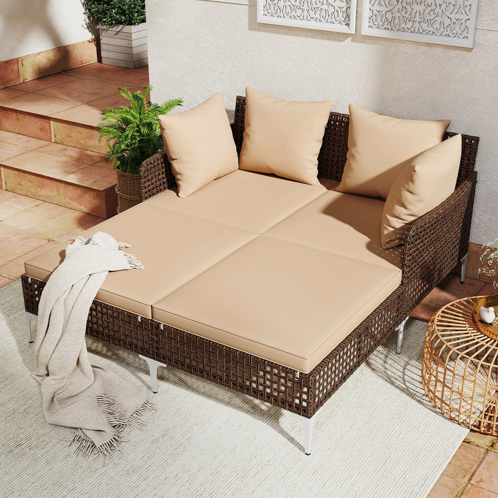 Outdoor rattan double daybed chaise lounge in brown with cushions, perfect for poolside relaxation and comfort.