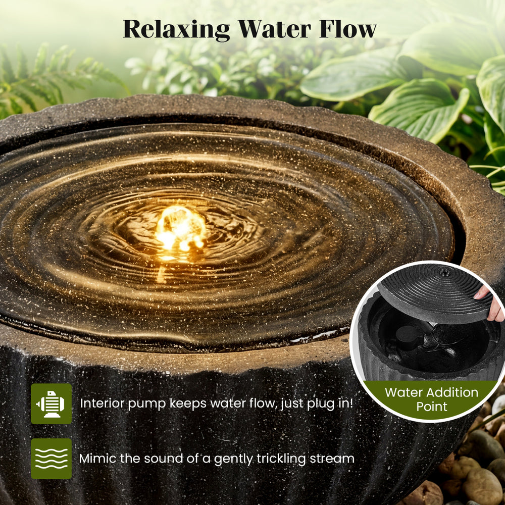 Round sphere water fountain with LED lights, featuring a realistic stone look and adjustable flow for tranquil outdoor.