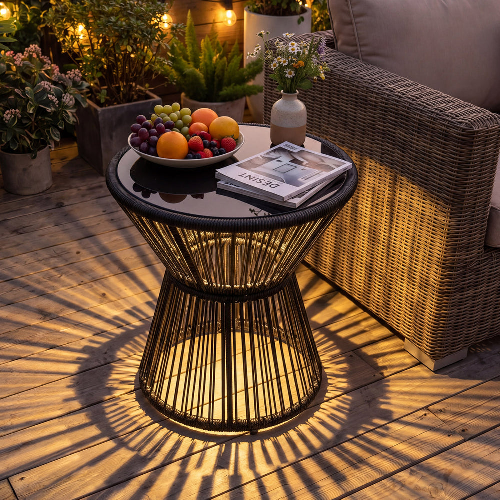 Outdoor side table with LED warm light, tempered glass top, and black PE rattan, perfect for patio or garden use.