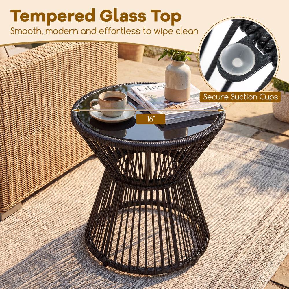 Outdoor side table with a 16" tempered glass top, black PE rattan design, perfect for patio or garden use.