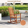 Outdoor rocking chair in solid wood with high backrest and slatted seat, perfect for patio relaxation.