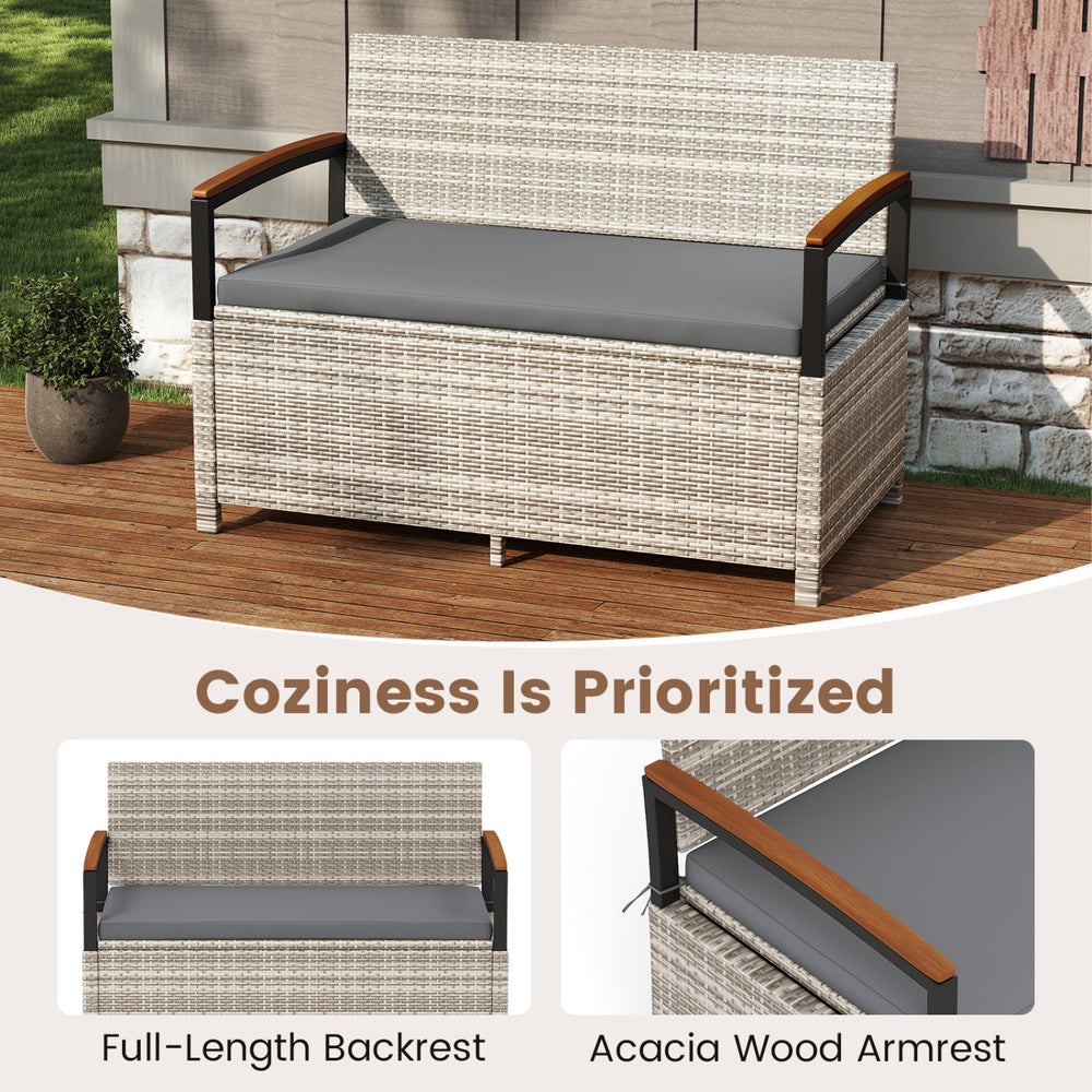 Outdoor storage bench with gray cushion, acacia wood armrests, and full-length backrest for patio comfort and style.