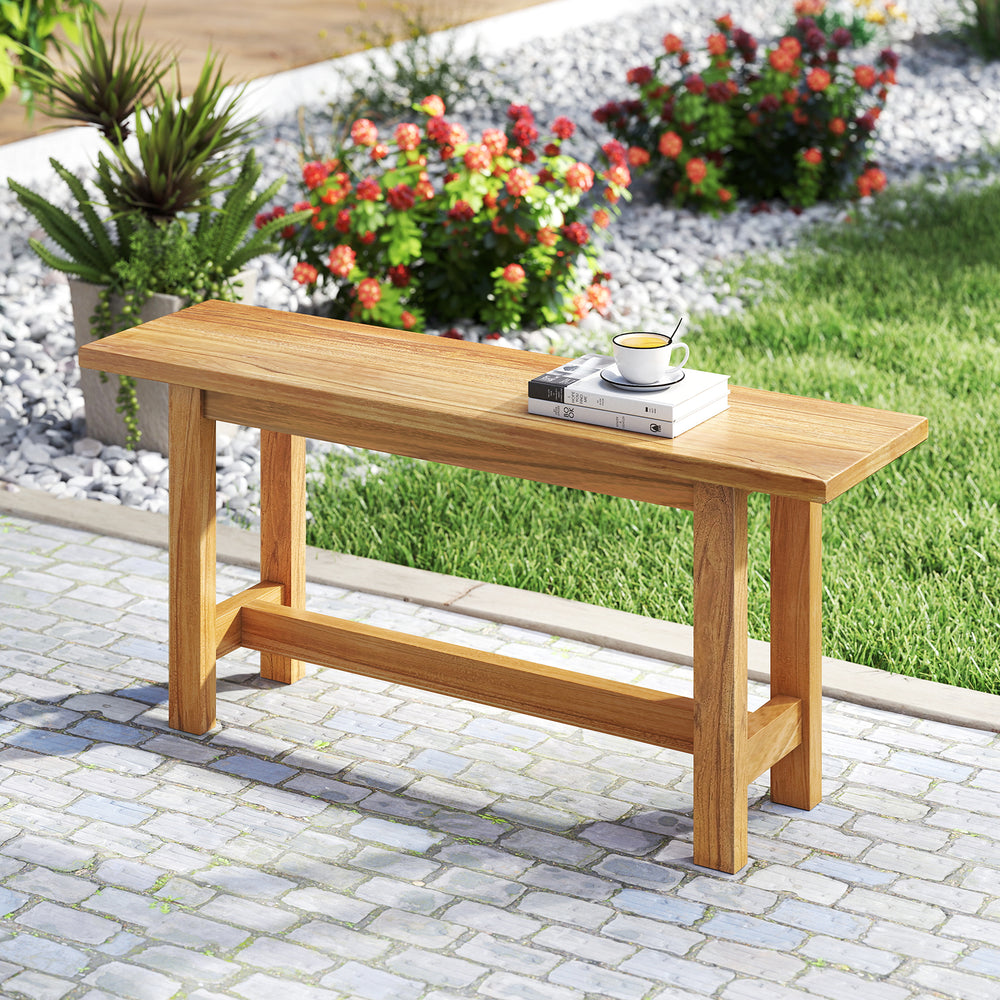 Teak wood bench with H-shaped legs, perfect for porch or poolside, offering elegant outdoor seating for two.