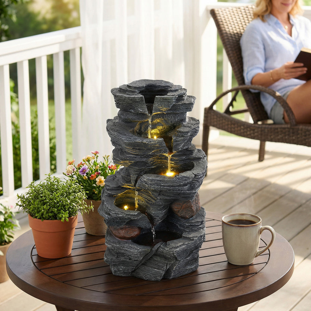 5-tier tabletop water fountain in realistic stone gray with LED lights, creating a calming ambiance for outdoor.