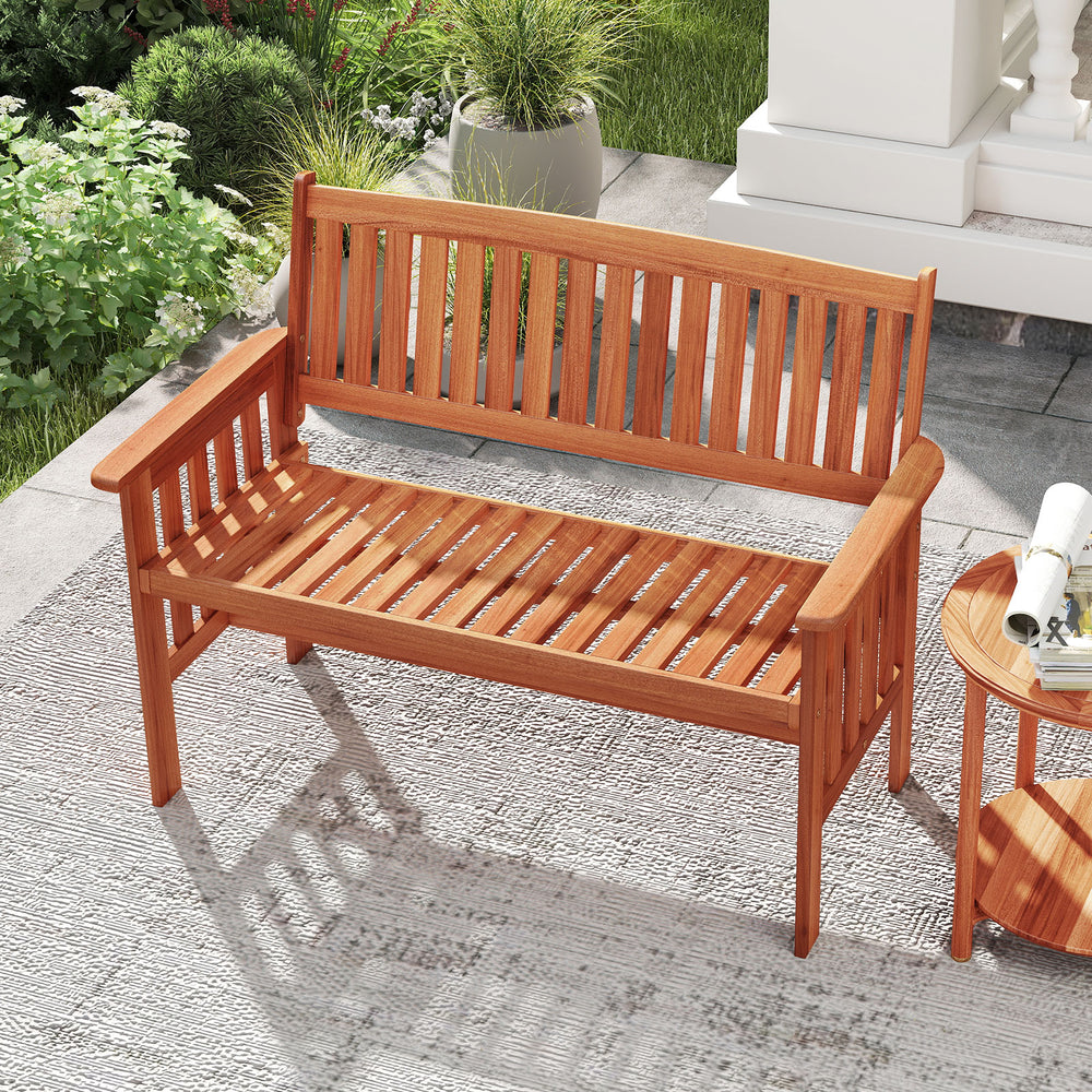 Two-person outdoor wood garden bench with slatted seat, backrest, and armrests, perfect for patio relaxation.