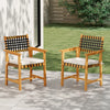 Set of 2 outdoor wooden dining chairs with armrests, curved back, and padded cushions for comfort in garden settings.
