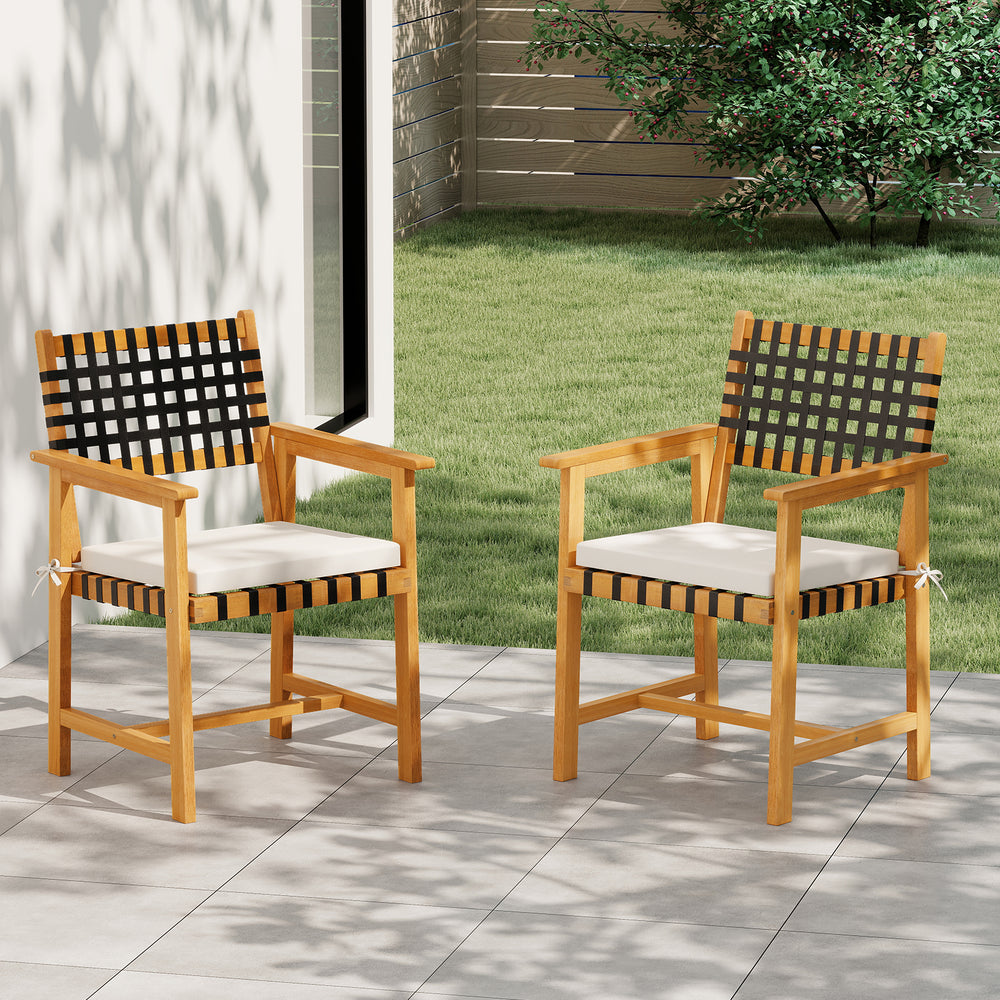 Set of 2 outdoor wooden dining chairs with armrests, curved back, and padded cushions for comfort in garden settings.