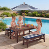 Kids enjoying playtime at the outdoor wooden picnic table with removable umbrella and blue cushions by the pool.