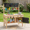 Wooden outdoor mud kitchen for kids with sink, stove, storage, and blackboards for imaginative play and creativity.