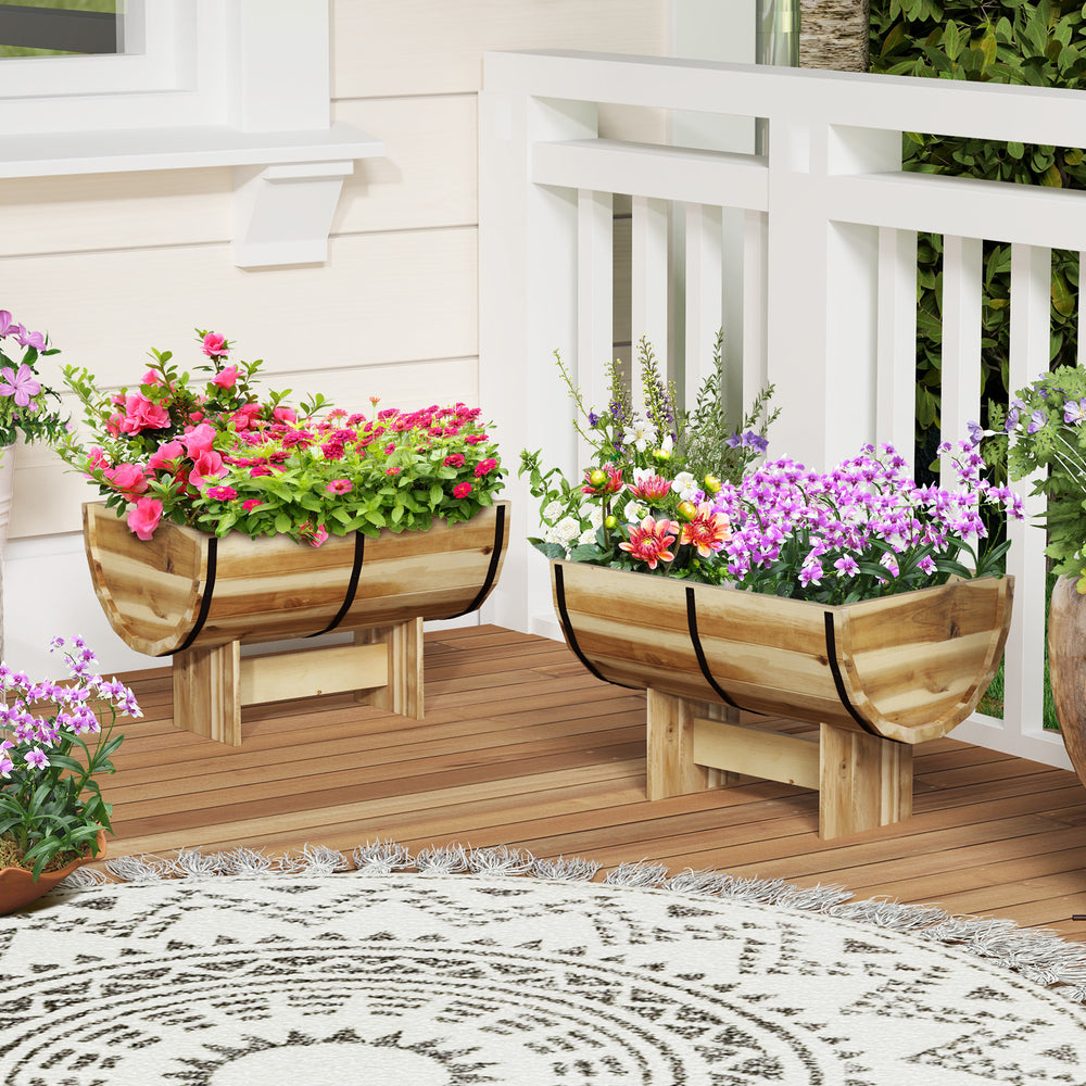 Half whiskey barrel-shaped outdoor wooden planters with legs, crafted from acacia wood, ideal for flowers and herbs.