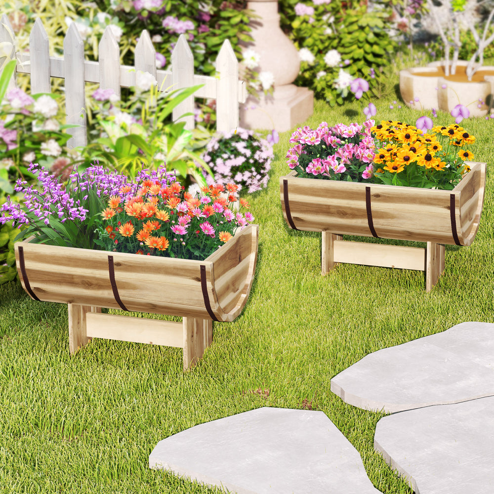 Outdoor wooden planter with legs in half whiskey barrel shape, made of acacia wood, perfect for vibrant garden displays.