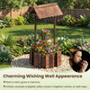 Outdoor wooden wishing well planter with rustic burnt-like finish, perfect for growing flowers and concealing utilities.
