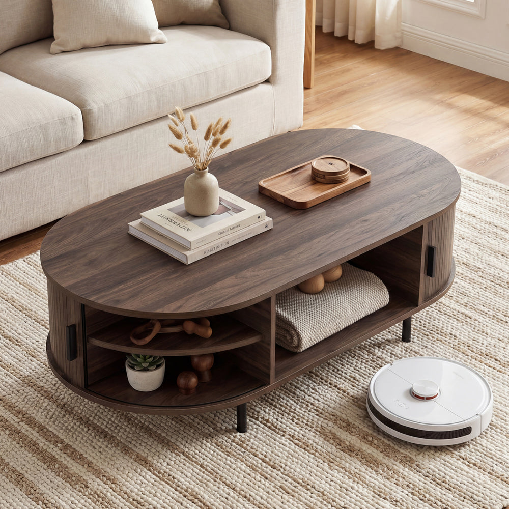 Oval coffee table with walnut finish, showcasing a spacious top and hidden back shelves for organized living room.