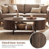 Oval coffee table with fluted door accents, walnut finish, and dual side shelves for stylish living room storage.