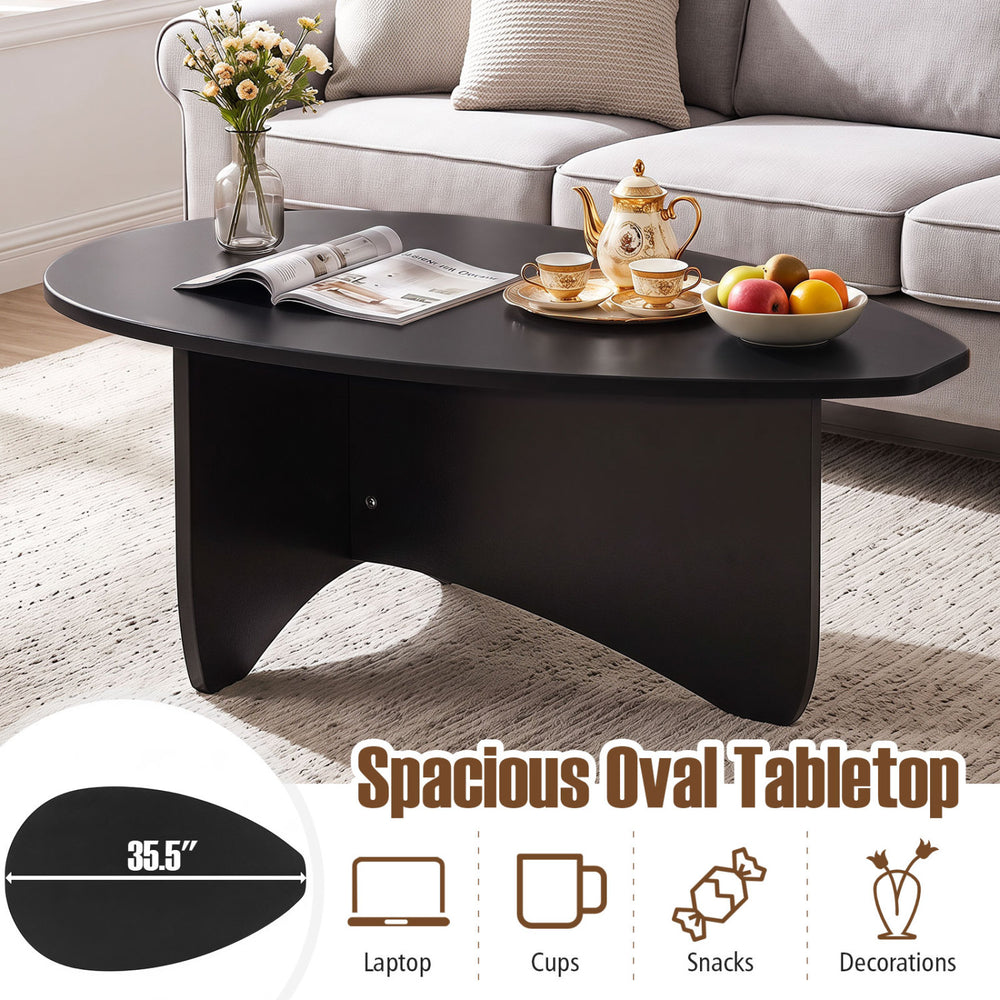 Spacious oval black coffee table with a low-profile design, perfect for laptops, snacks, and easy lounging.