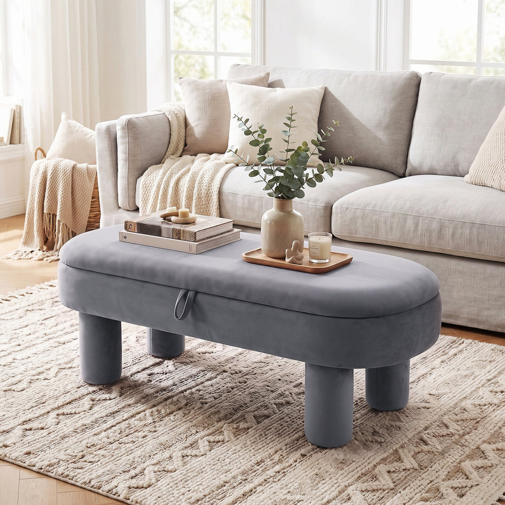 Oval storage ottoman bench in soft velvet fabric with hidden storage, perfect for living areas and easy access to essentials.