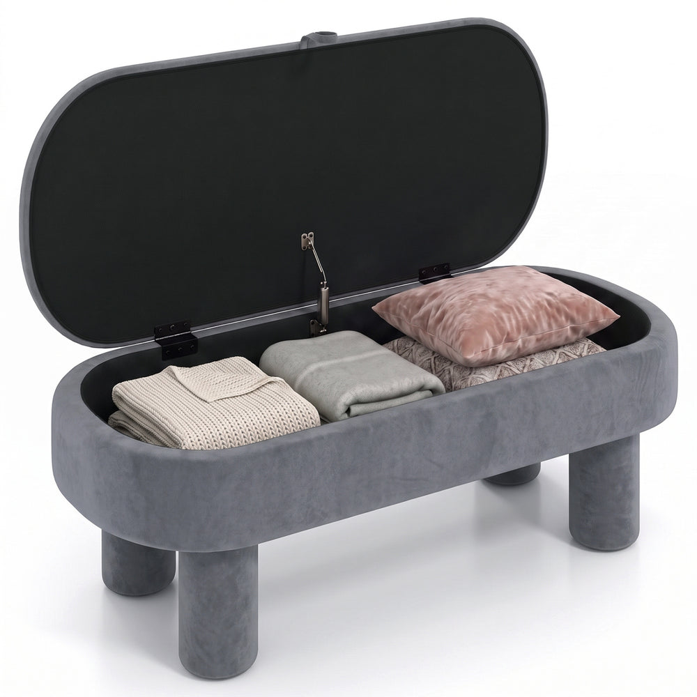 Oval storage ottoman bench in soft velvet with hidden storage, perfect for blankets and pillows in modern living spaces.