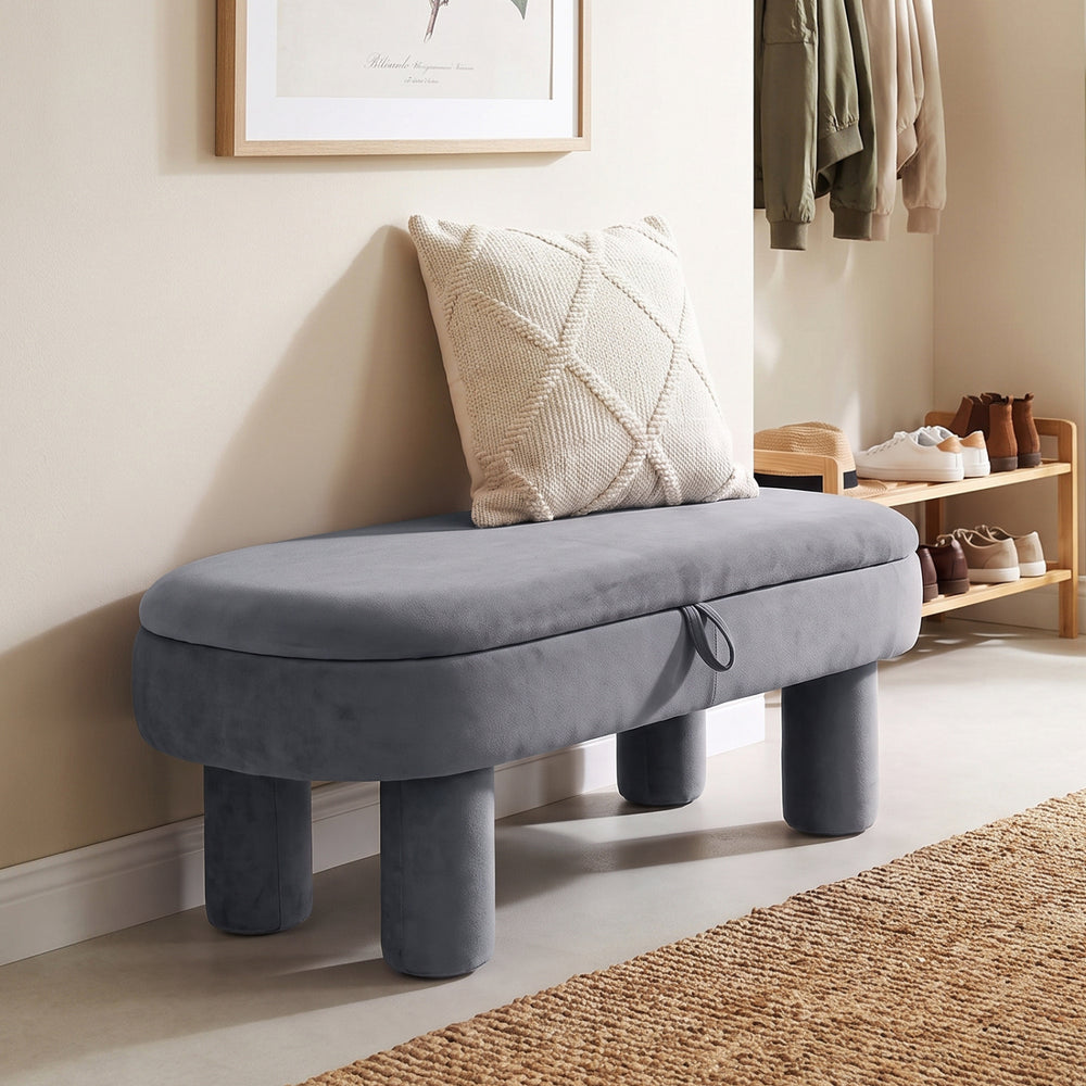 Oval storage ottoman bench in soft velvet fabric with hidden storage, perfect for entryways or bedrooms.