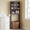 Over toilet storage cabinet with sliding barn door, open shelves, and rustic oak finish for bathroom organization.