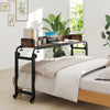 Overbed desk with wheels in brown, adjustable height, sturdy design, ideal for working or reading over a queen size bed.