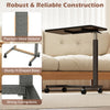 Overbed table with walnut finish, lockable wheels, and sturdy H-shaped base for home and hospital use.