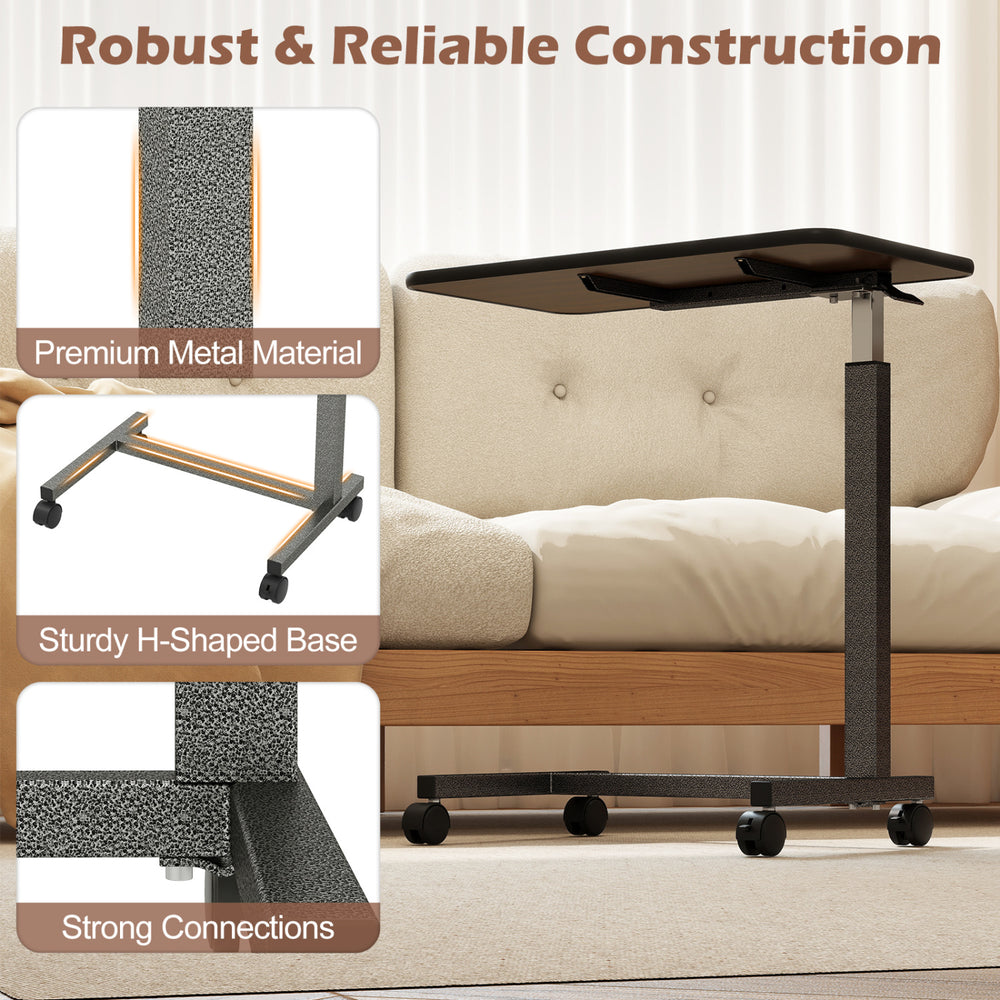 Overbed table with walnut finish, lockable wheels, and sturdy H-shaped base for home and hospital use.