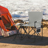 Oversized gray camping chair with side table, cup holder, and storage pockets, ideal for outdoor relaxation.