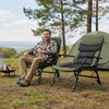 Oversized foldable fishing chair in green with adjustable backrest and armrests, perfect for camping or lounging.