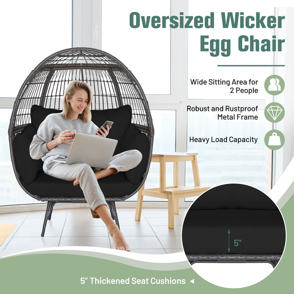 Oversized wicker egg chair with thickened cushions and sturdy metal frame, perfect for indoor or outdoor relaxation.