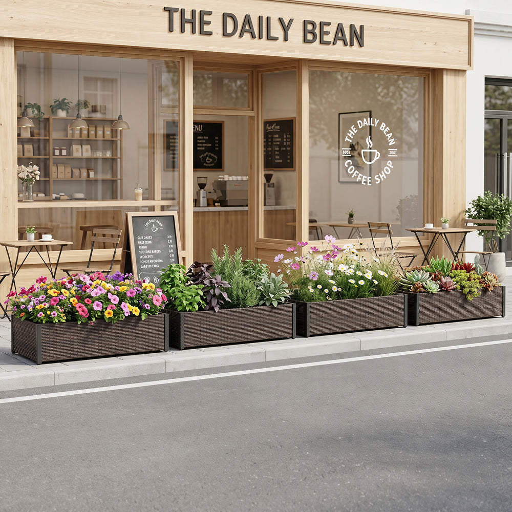 Large PE rattan raised garden bed with removable liner, perfect for planting flowers and herbs on patios or balconies.