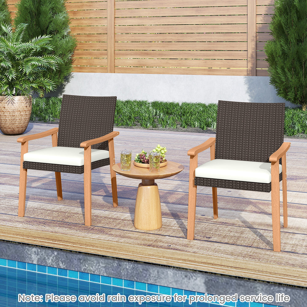 Two PE rattan outdoor dining chairs with acacia wood armrests and removable cushions, ideal for patio relaxation.