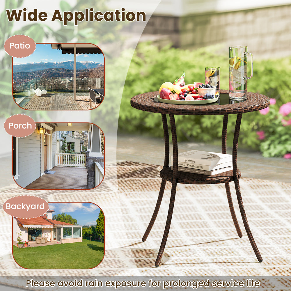 Round PE wicker patio bistro table with tempered glass top and shelf, ideal for outdoor use on patio or balcony.