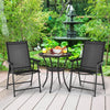 Set of 2 black outdoor patio folding chairs with ergonomic armrests, placed on a deck in a lush garden setting.