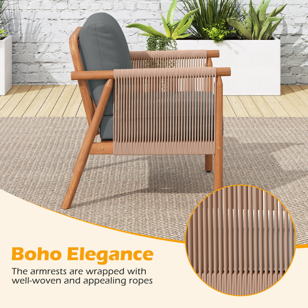 Side view of a patio acacia wood chair featuring woven rope armrests and gray cushions, ideal for backyard relaxation.