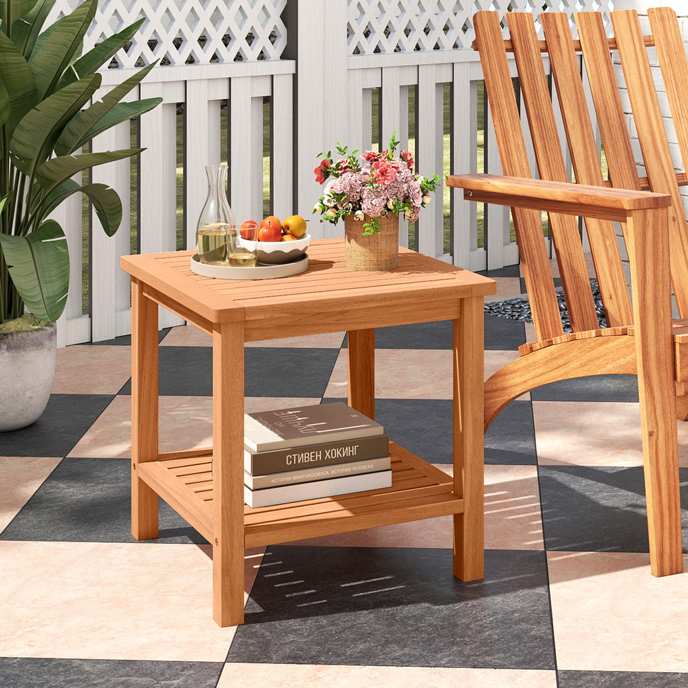 Acacia wood side table with slatted tabletop and storage shelf, perfect for patio or balcony use.