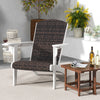 Close-up of the rattan weave on the patio Adirondack chair's padded seat, showcasing elegant design and comfort.