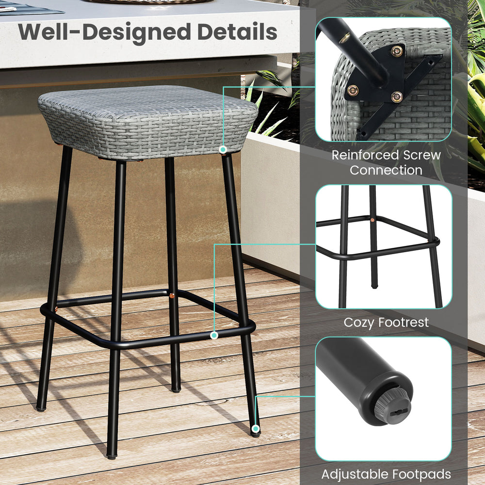 Patio bar stool with rattan seat and sturdy metal frame, featuring adjustable footpads for enhanced stability.